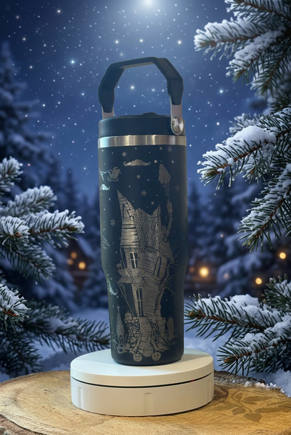 Black 30oz thermal tumbler with engraved haunted house design, on a moonlit festive background