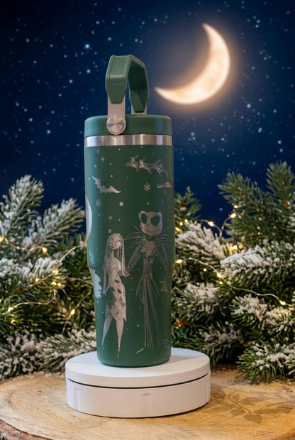 Green 30oz thermal tumbler with silver-toned Night Before Christmas engraving and colour-matched carry-handle lid, on a moonlit festive background