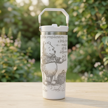 White Winnie-the-Pooh engraved carry-handle bottle on a wooden tabletop in a garden