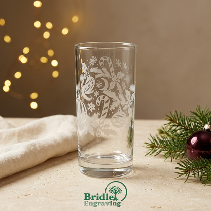Candy cane and bauble engraved glass, second view, with festive background and Bridle Engraving logo