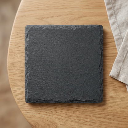 Blank square slate coaster on an oak table